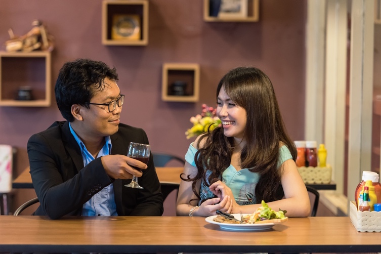 Man and woman conversing during date