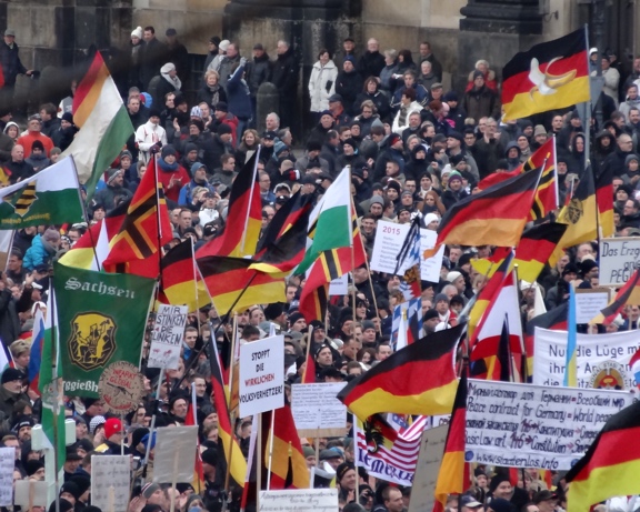 Gathering of protestors with flags and signs