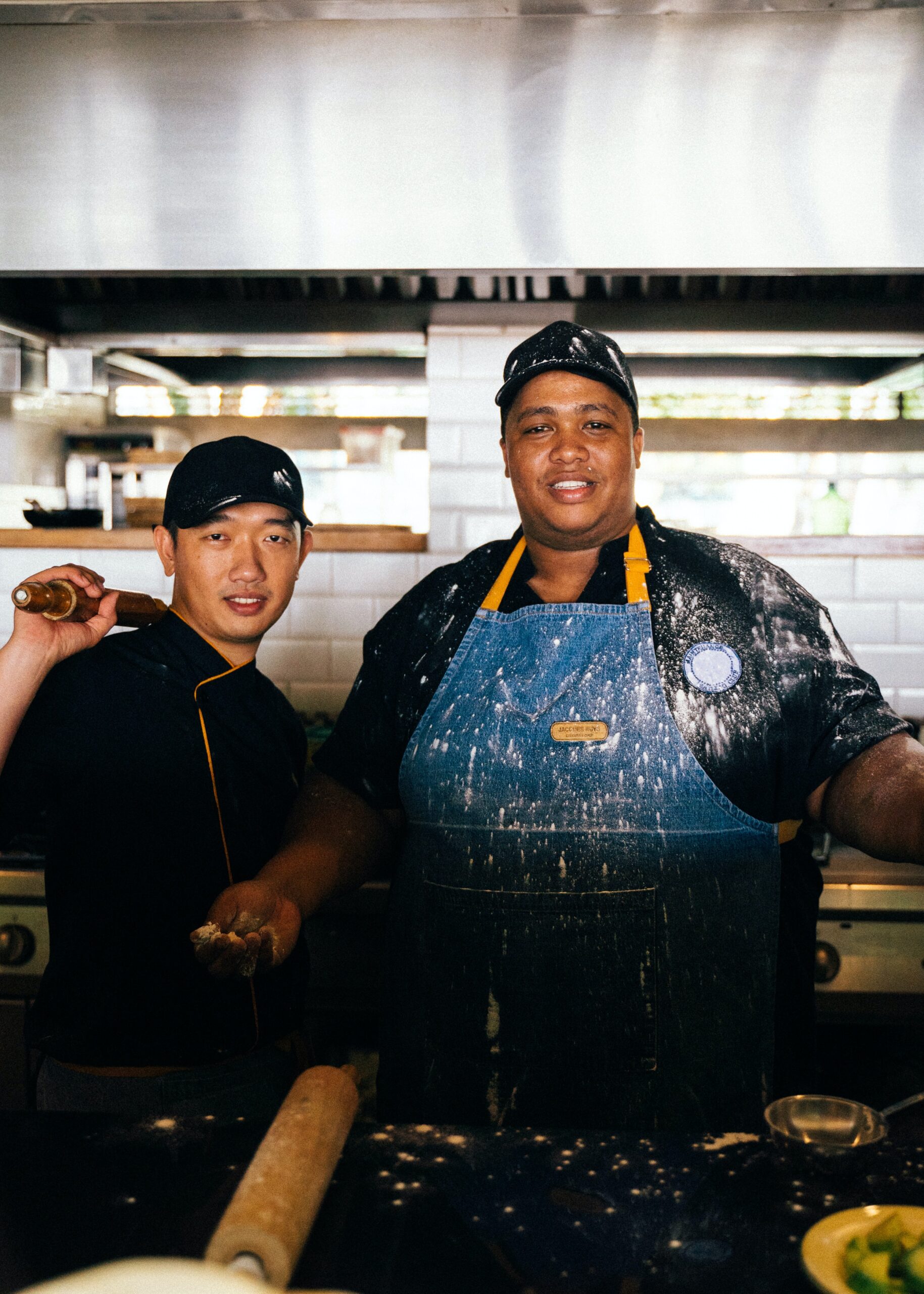 Two bakers in a kitchen.