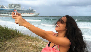 Woman taking a selfie on the beach