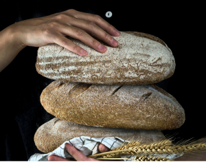 A stack of 3 loaves of bread